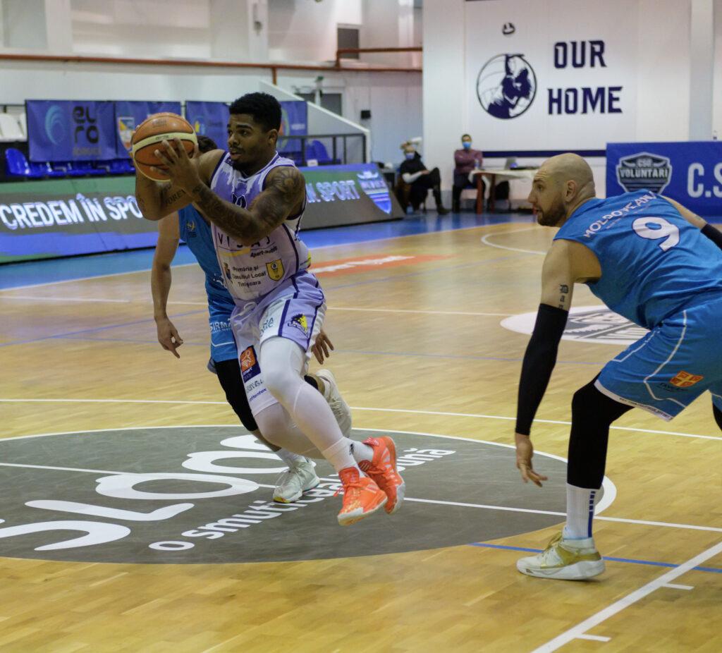 Player driving against offense in a basketball game in Voluntari Romania