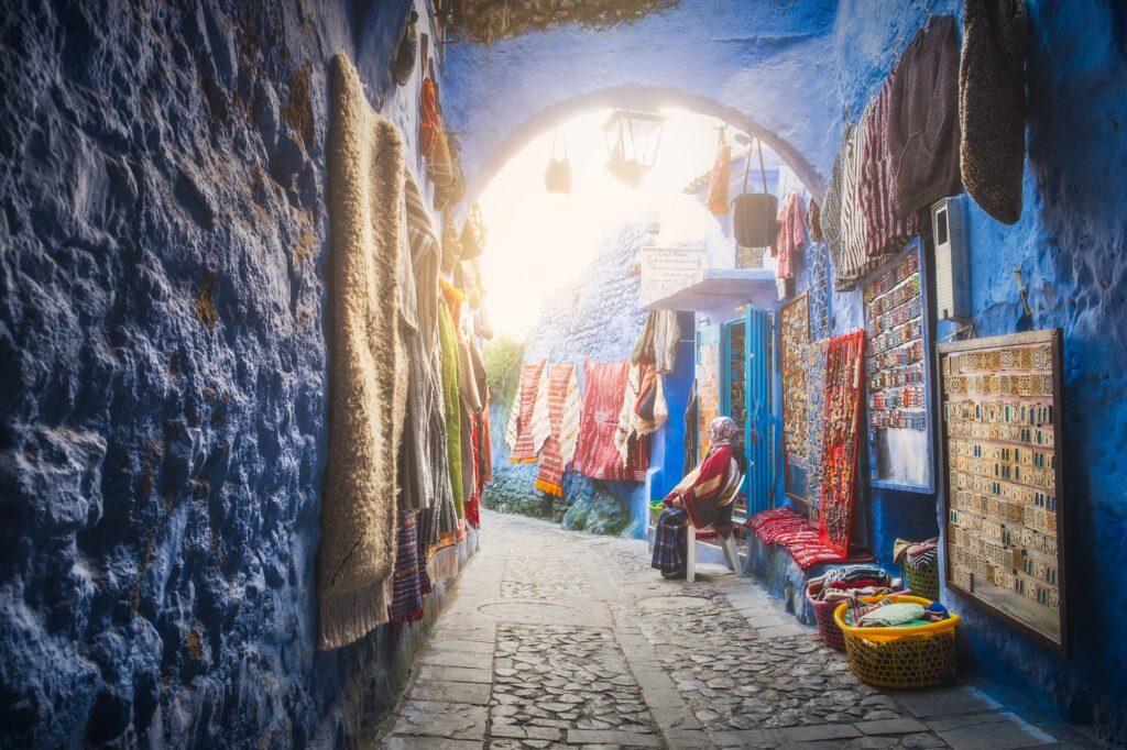 Woman outside of shop in Chefchaouen Morocco