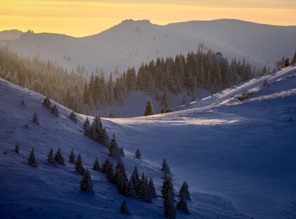 Sunset landscape winter photography in the Ciucas Mountains in Romania
