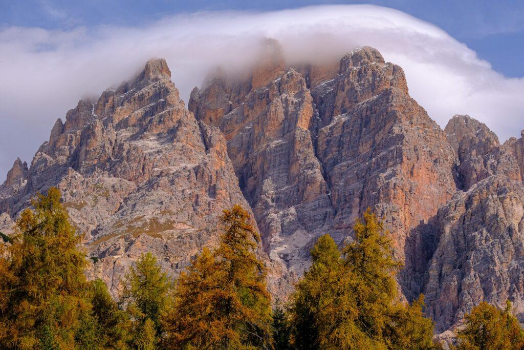 Peaks gently covered by fog in the Dolomites Italy