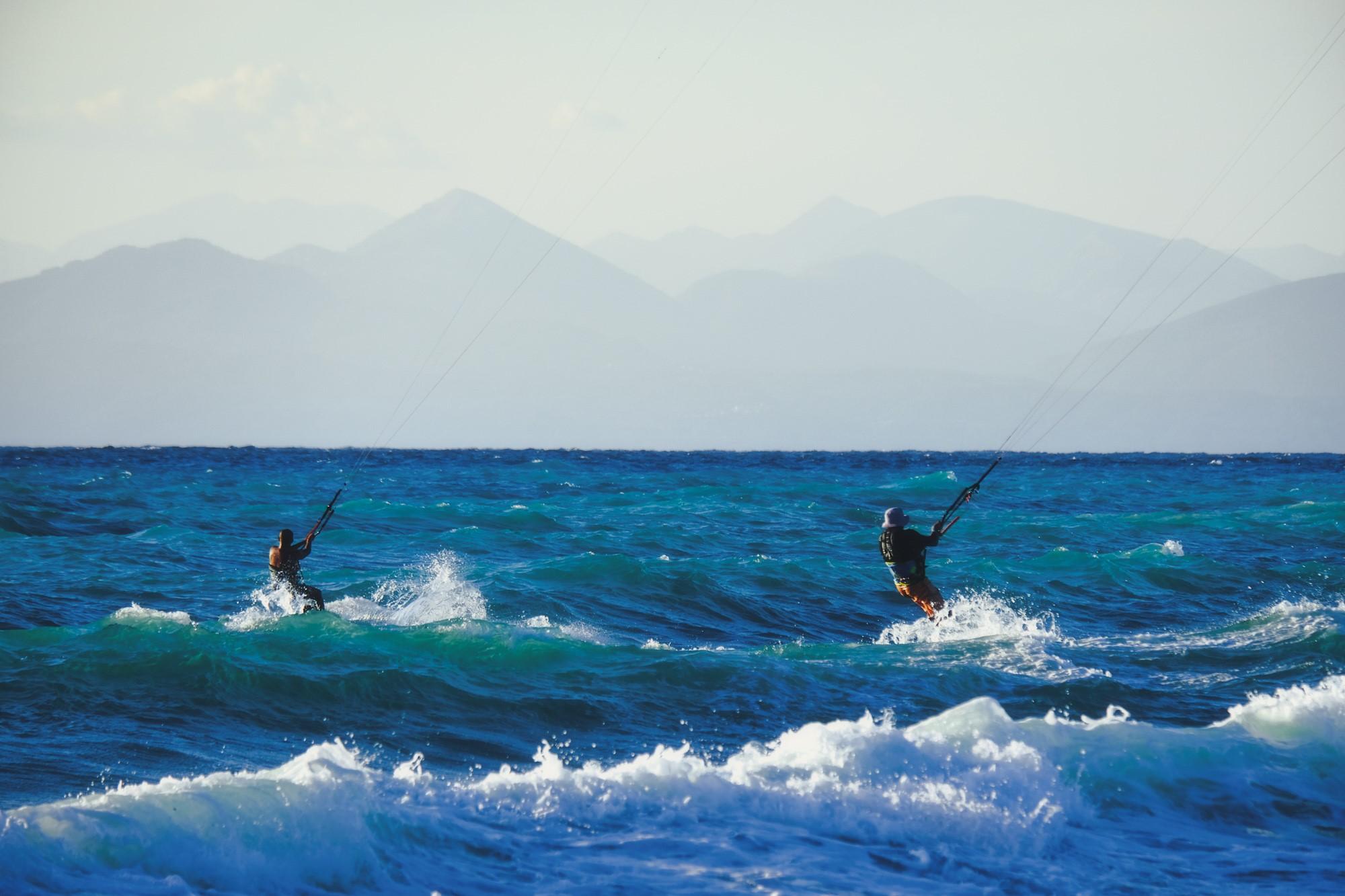 Kitesurfers riding waves in the Ionian Sea in Lefkada Greece