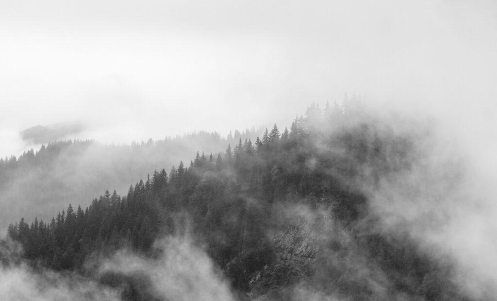 Black and white landscape scene on misty Transfagarasan road in Romania