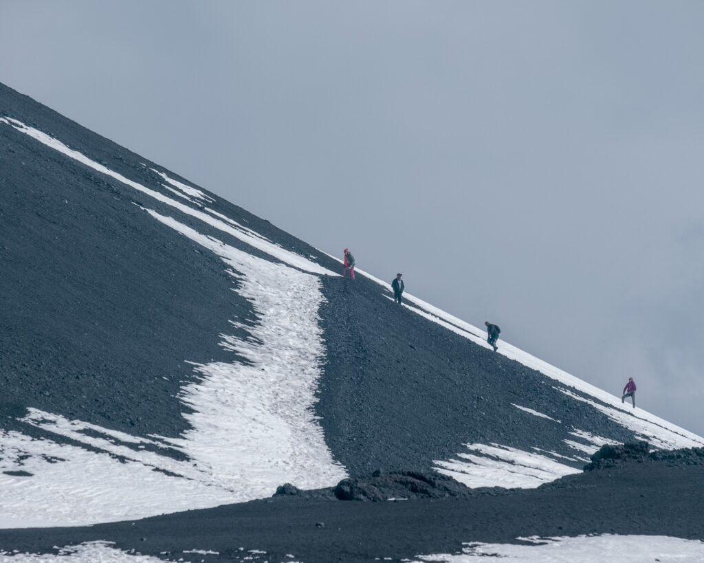 Hikers enjoying the ridges of Mount Etna in Sicily