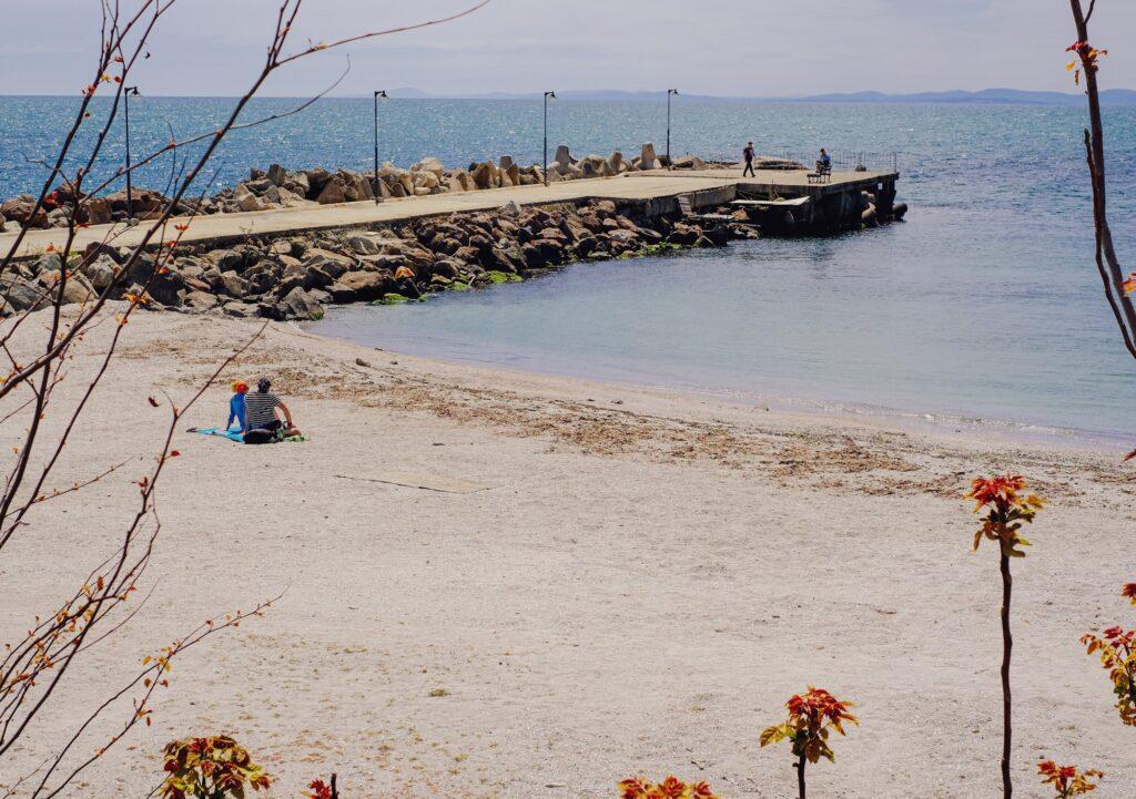 People enjoying a small beach in Nessebar Bulgaria