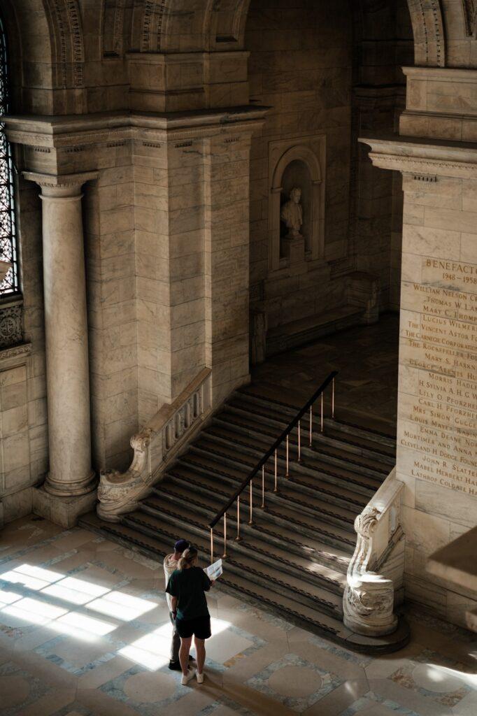 Couple looking for directions in the Public Library of New York