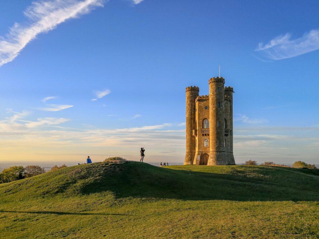People waiting for the sunset at Broadway Tower in The Cotswolds England