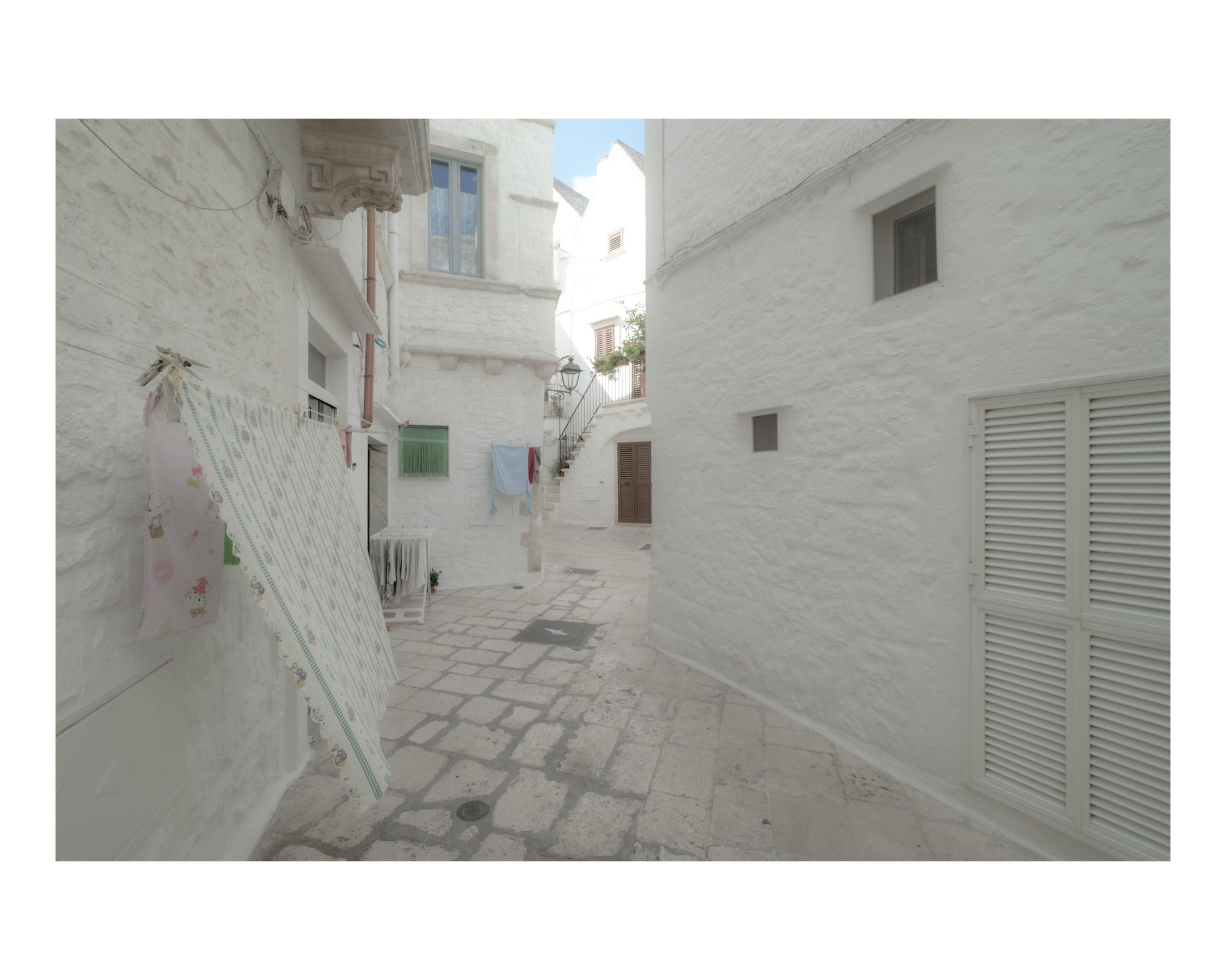 Empty street in Locorotondo Puglia photographed with a wide lens