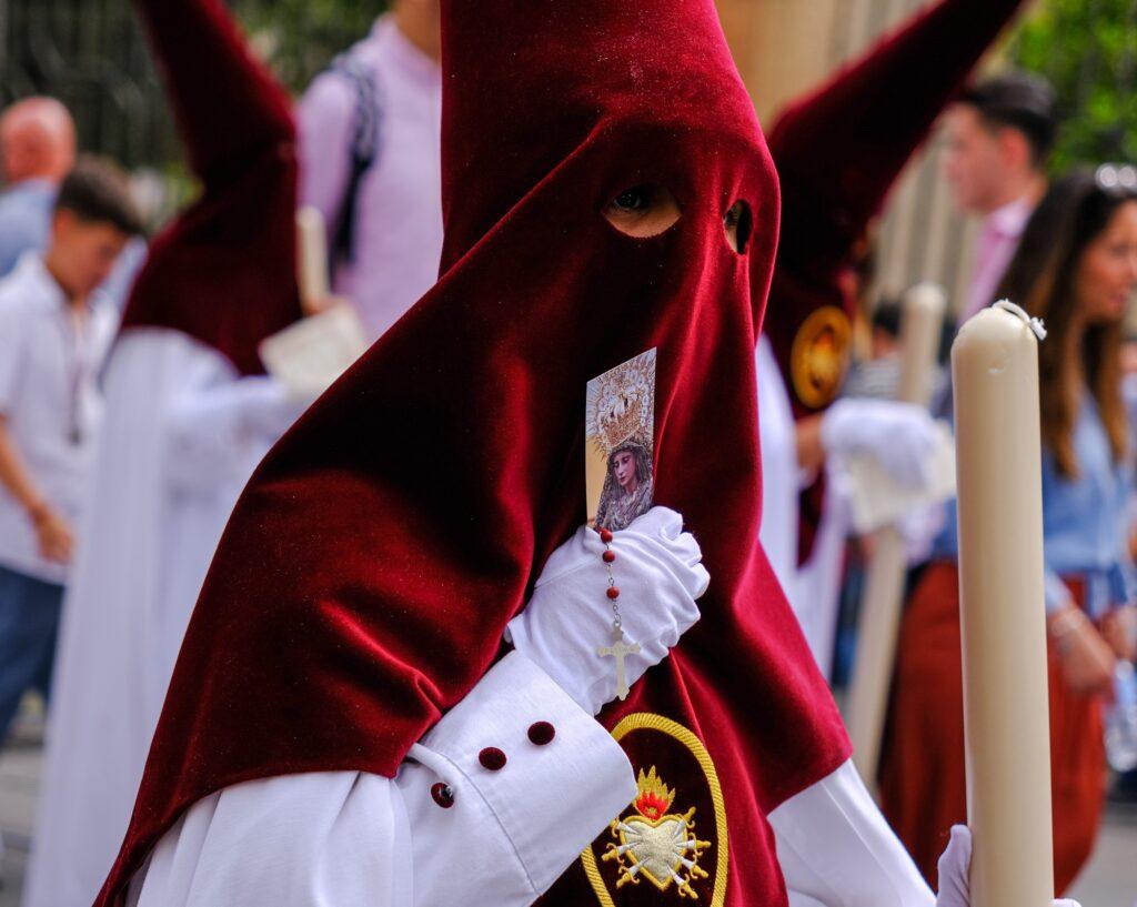 Nazareno participant during Semana Santa in Seville Spain