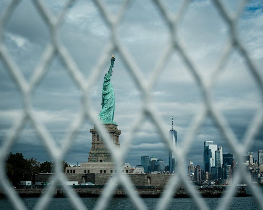 Statue of Liberty shot from the safety fence on the boat in New York