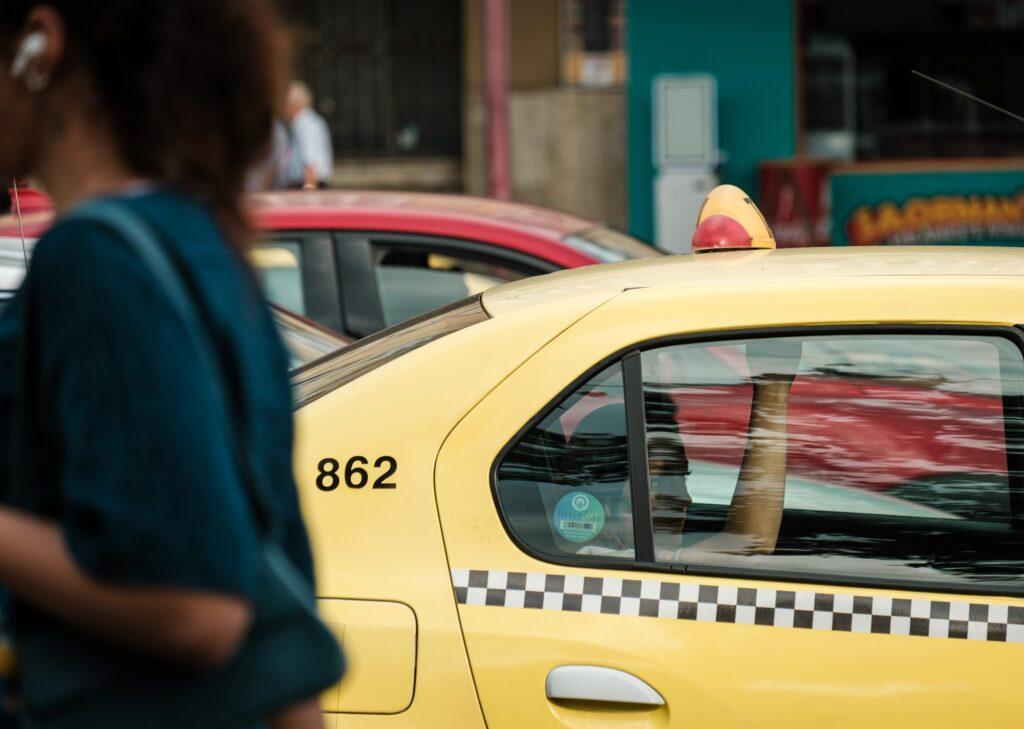 A yellow cab in traffic in Bucharest Romania