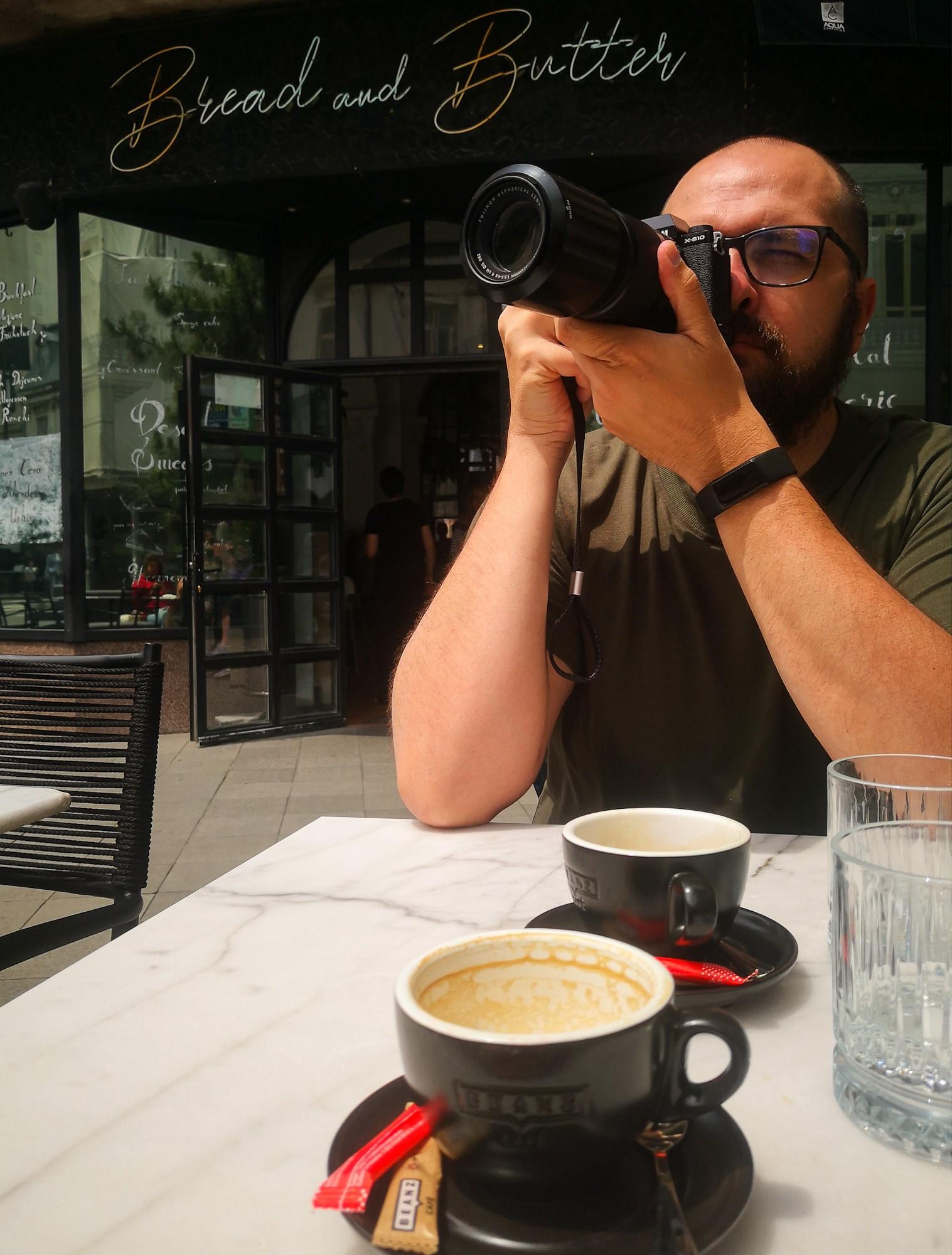 Enjoying a coffee and looking for new subjects to photograph in Bucharest