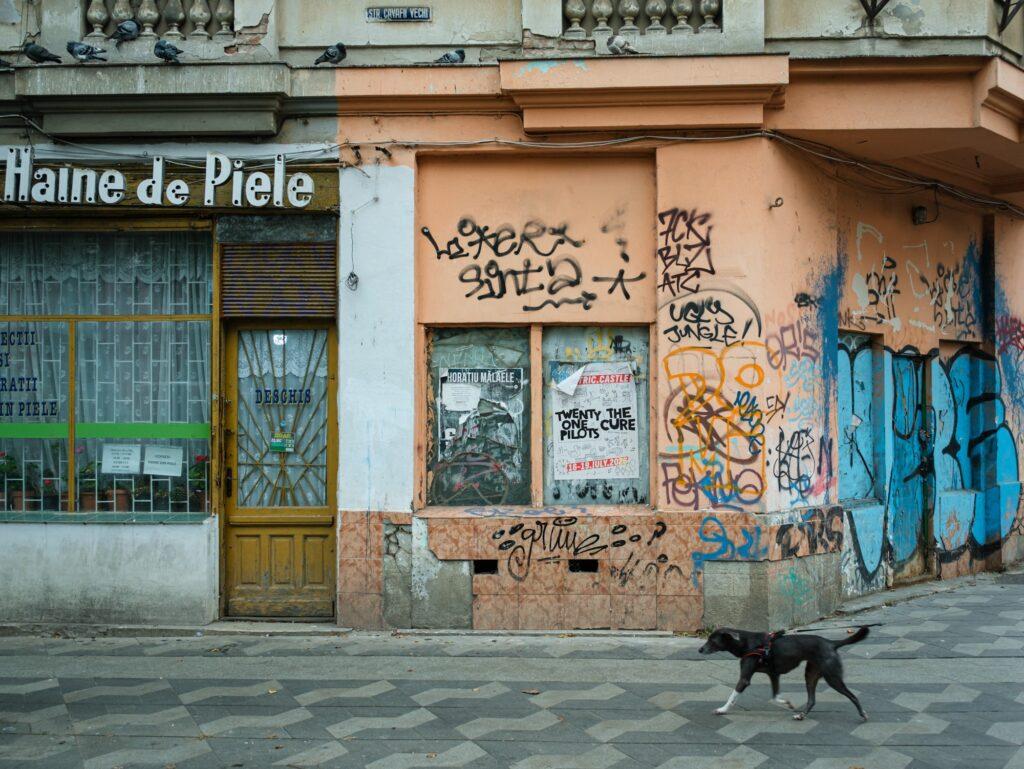 Old stores covered in graffitti in the center of Bucharest Romania