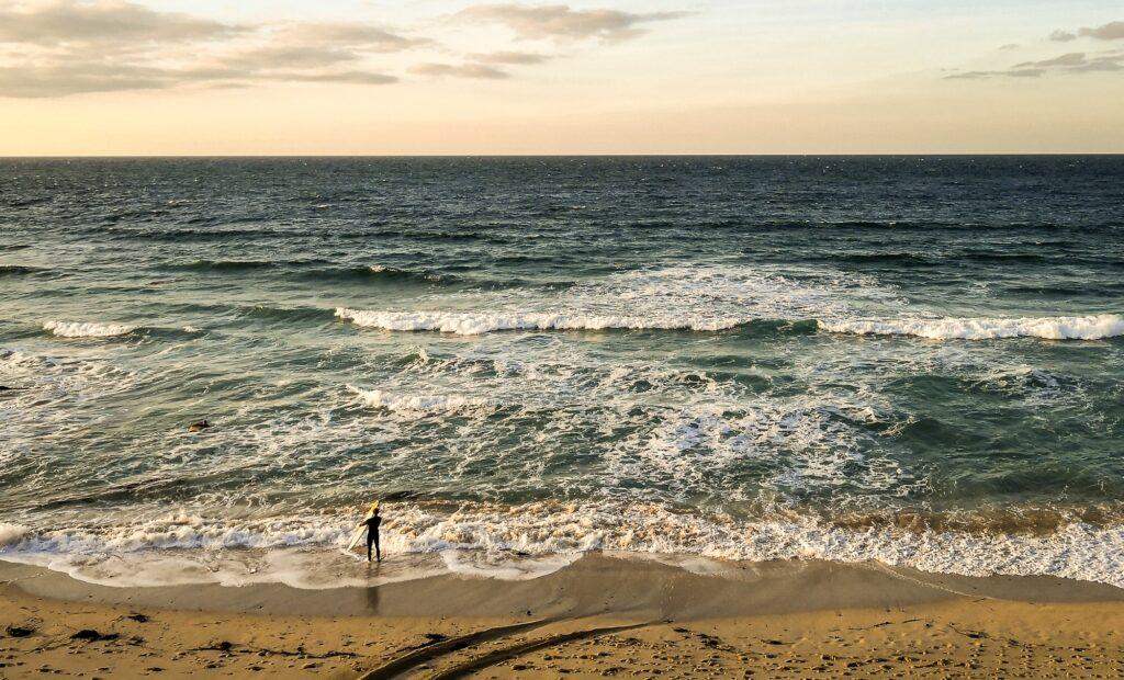 Last surfer at sunset in St Ives Cornwall