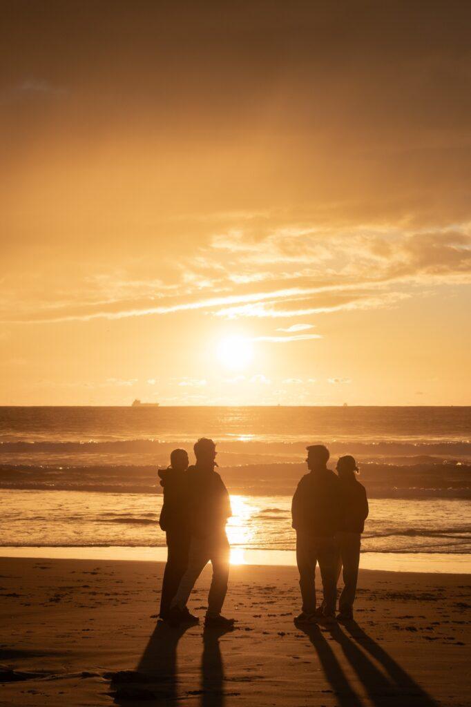 People having fun on an amazing sunset in Tarifa Spain
