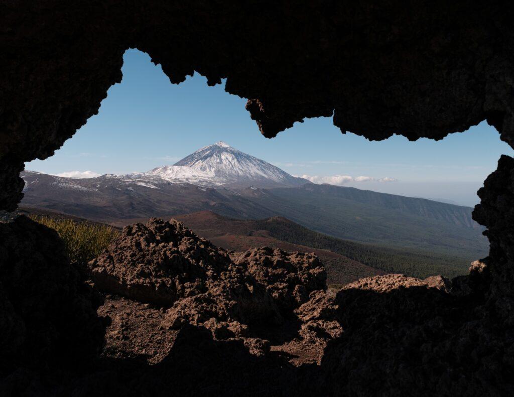 Landscape photography of mount Teide through a strange rock formation in Tenerife
