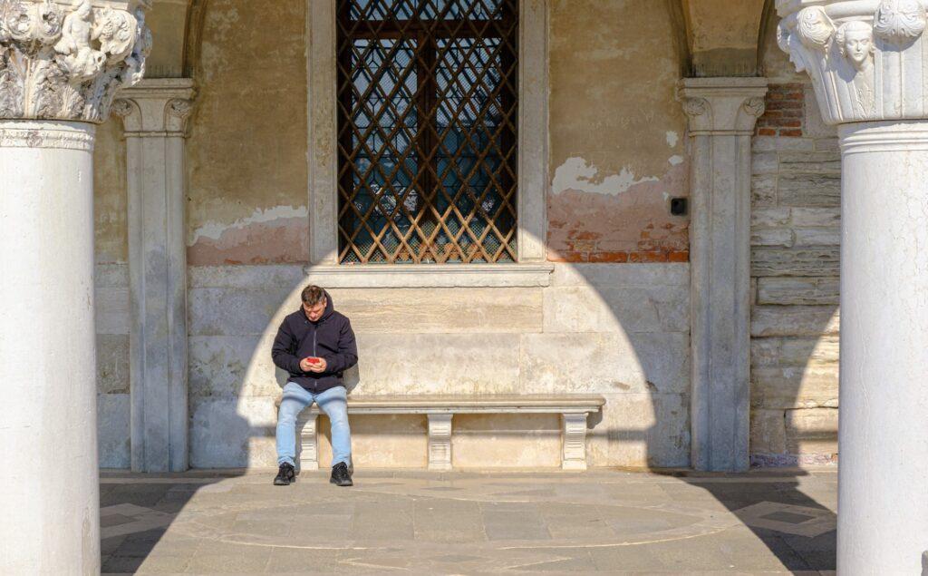 Quiet moments amidst the Carnival chaos in Venice Italy