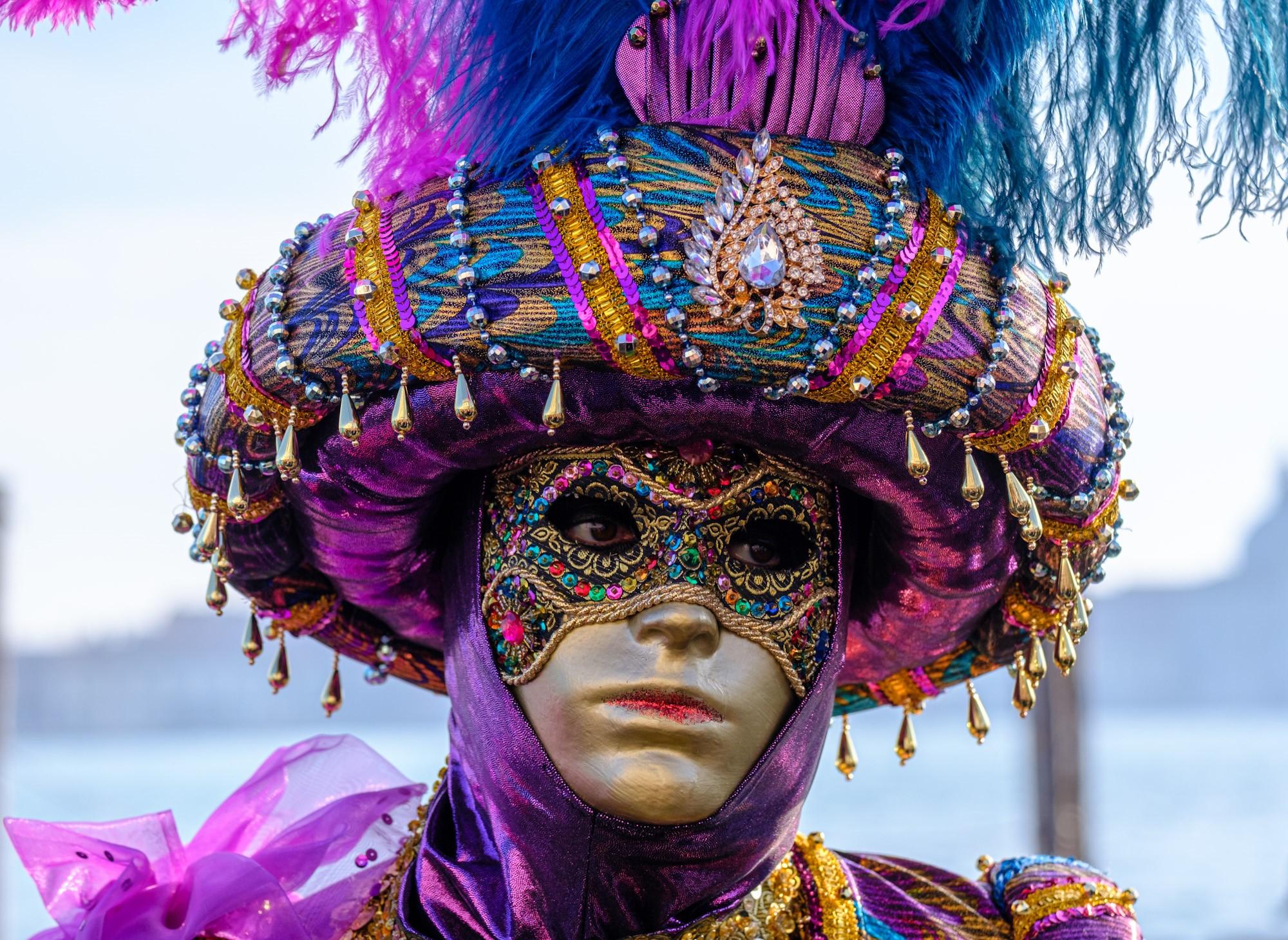 Carnival participant with traditional mask and outfit in Venice Italy