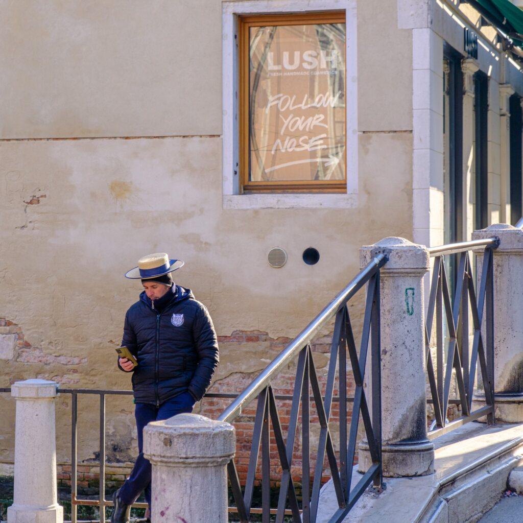 A gondolier in Venice Italy waiting for his next clients