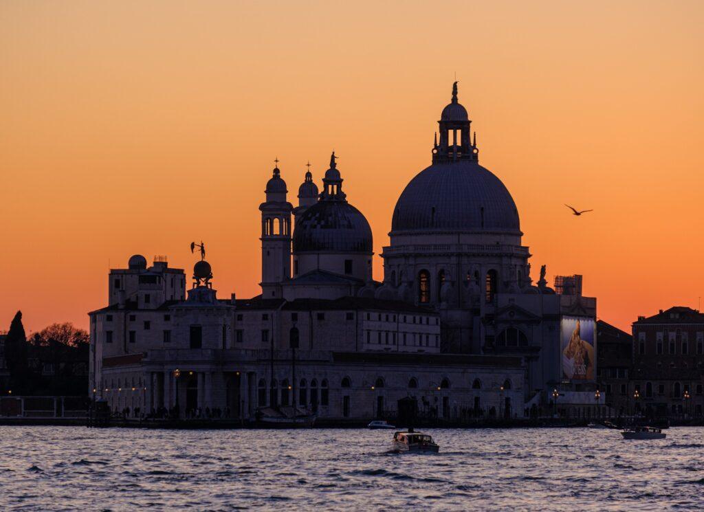 Small boats and an amazing sunset in Venice Italy
