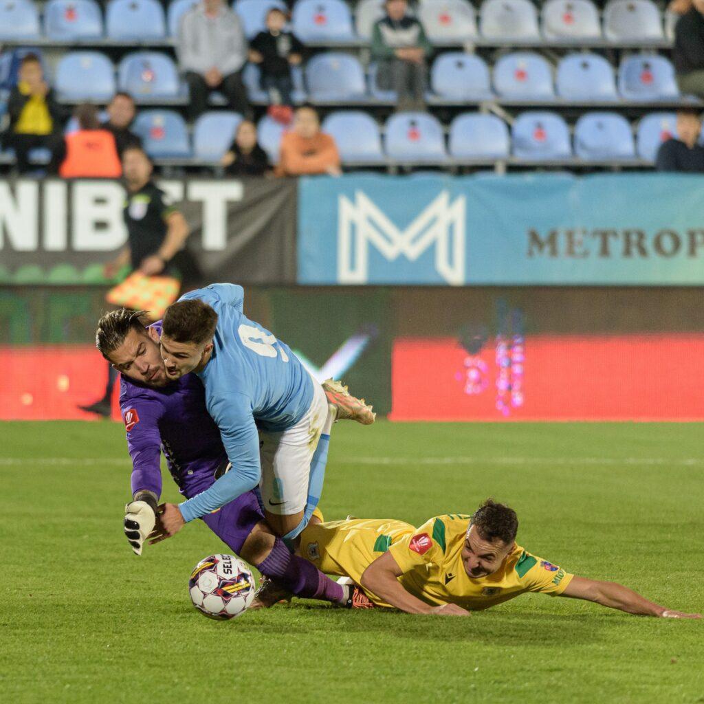Football players in action during a Superliga game in Voluntari Romania