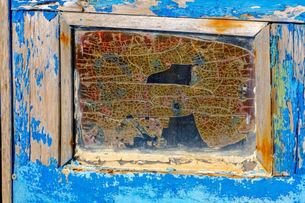 Old weathered window on a fishing boat in Nessebar Bulgaria