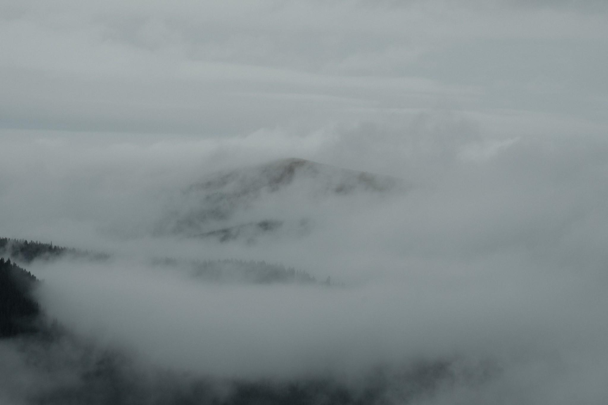 Peaks over fog on Transalpina road Romania