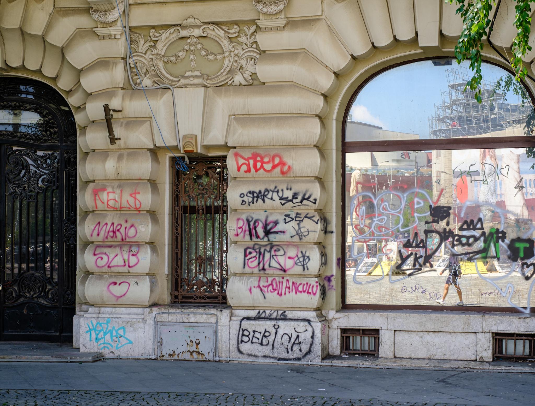 Historical building covered in graffitti in Bucharest Romania