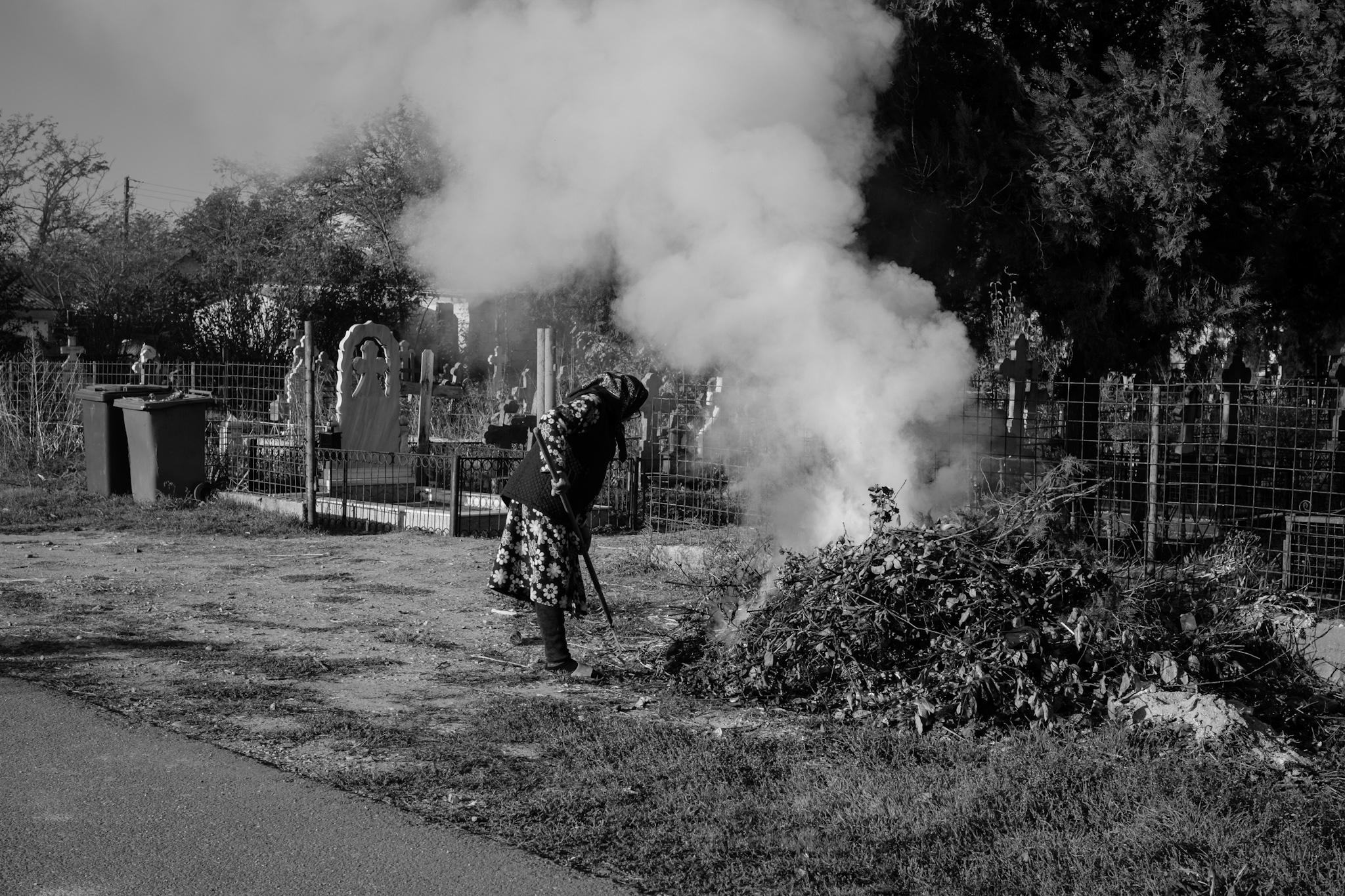 Old woman close to the railway 801 line in Romania